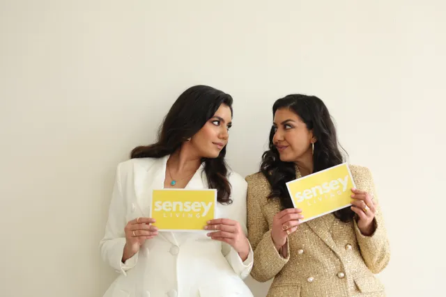 Aurora and her mother, Dr. Azadeh Khatibi, holding Sensey Living cards